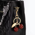 Cherry Luxe Bag Charm Keychain (Gold-tone cherry charm handbag accessory)